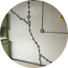 Close-up of a basement or foundation wall crack that has been properly sealed and repaired with injection material.