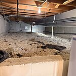 Crawl space waterproofing prep in Wheaton, IL with gravel base and moisture control groundwork by Premium Waterproofing