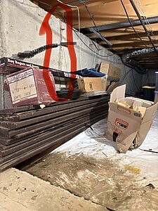 Crawl space encapsulation prep in Wheaton, IL showing foundation wall before sealing and vapor barrier install by Premium Waterproofing