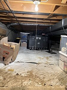 Before crawl space encapsulation in Wheaton, IL showing moisture issues and exposed ground prior to vapor barrier install by Premium Waterproofing