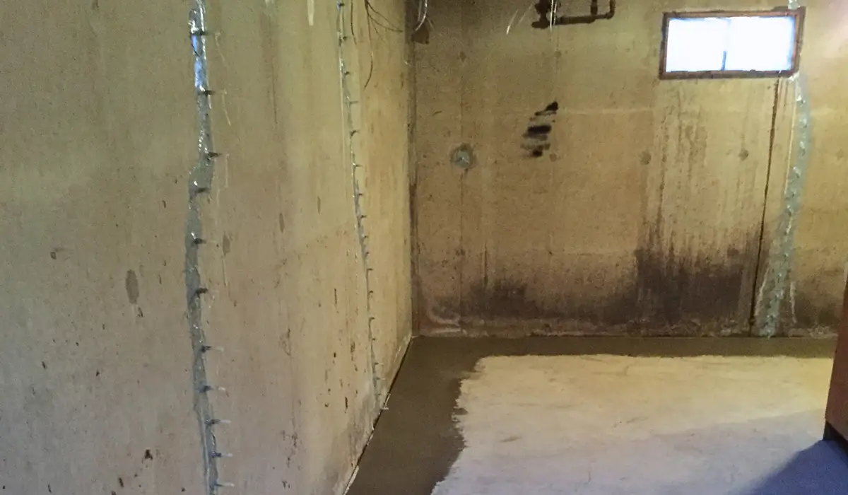 Water in basement along floor edge caused by hydrostatic pressure from snowmelt buildup